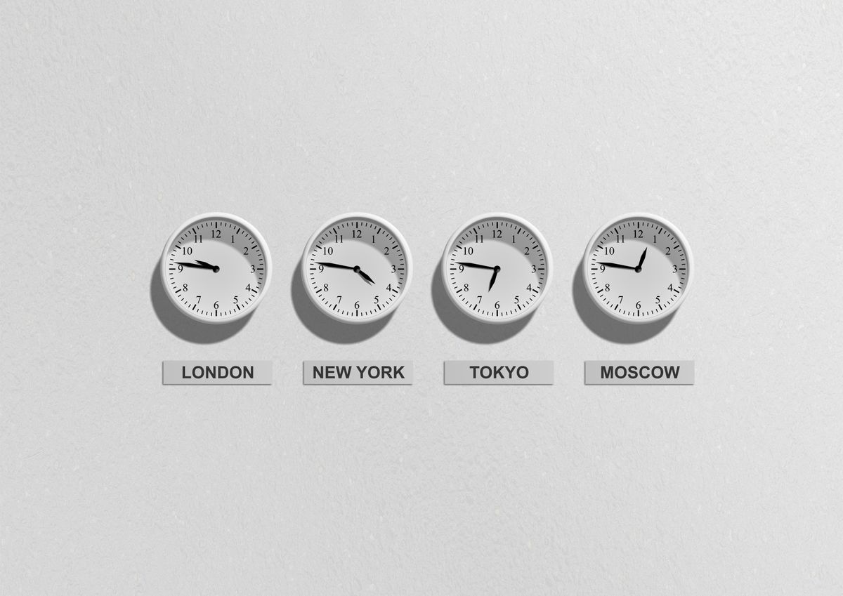 Four clocks labelled for different cities.