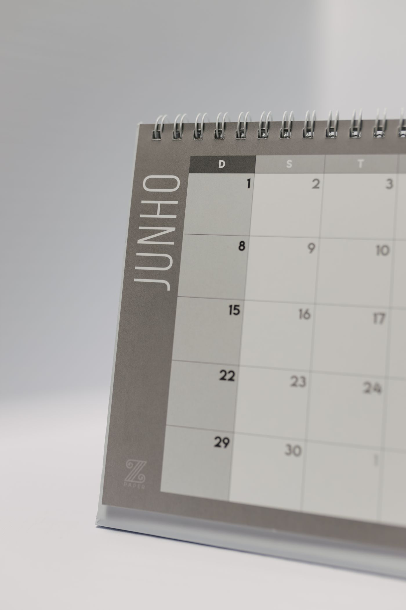 An open spiral desk calendar