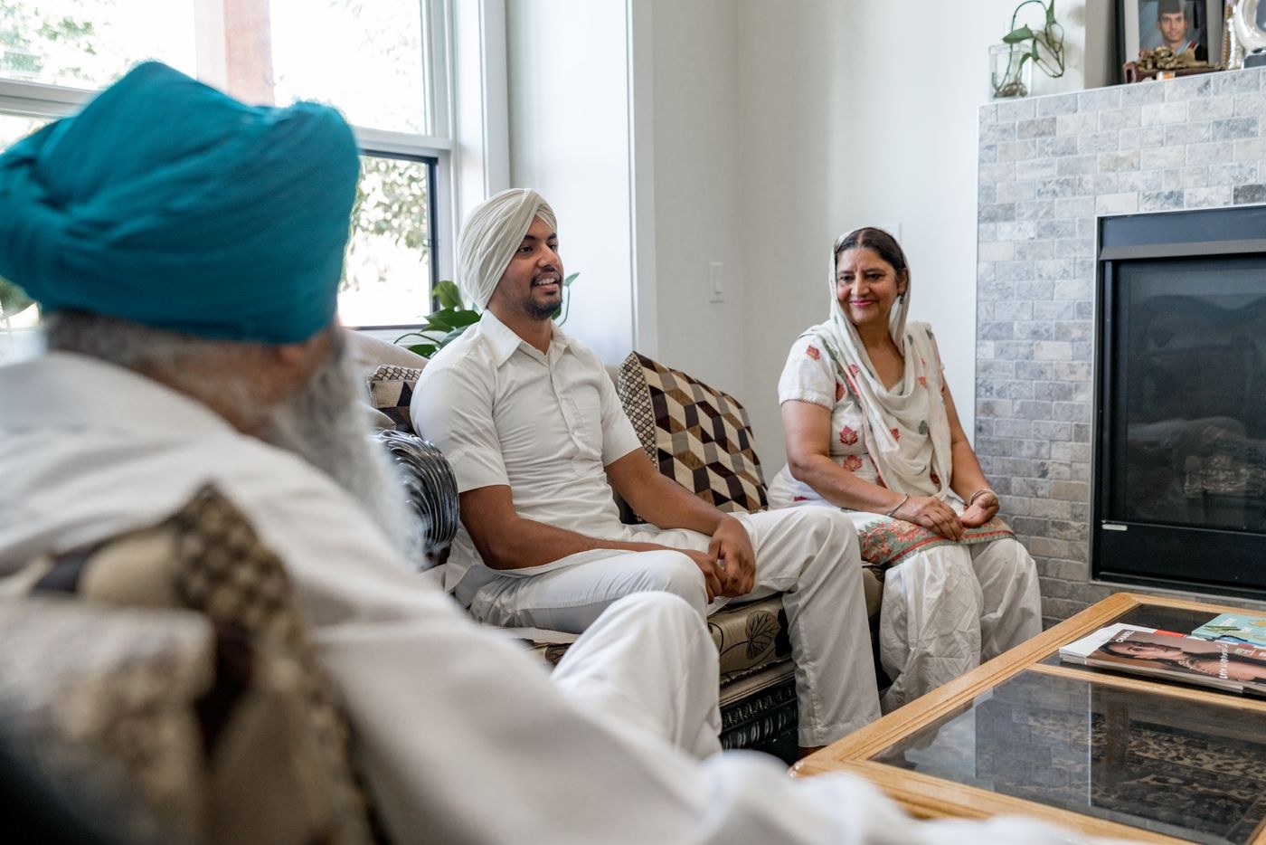 Family members sitting and talking in a living room